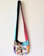 Patchwork shoulder bag with tree of life design.