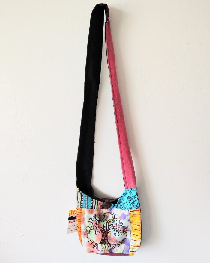 Colorful patchwork purse with tree design.