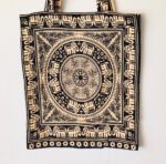 Black and beige tote bag with elephant design.