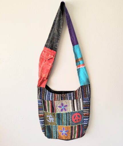 Patchwork shoulder bag with peace sign.