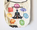 White tote bag with chakra symbols.