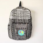 Black and white patterned backpack with peace sign.