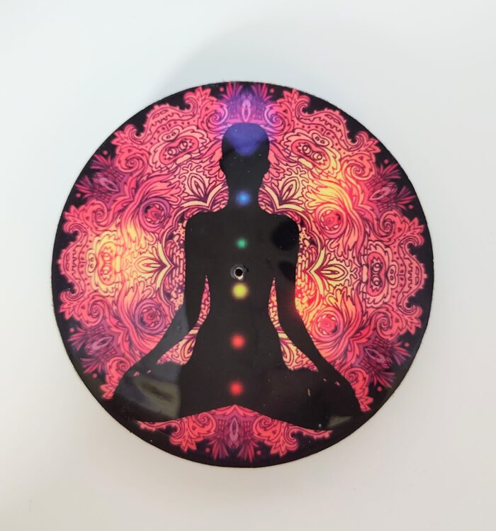 Chakra mandala with a meditating silhouette.