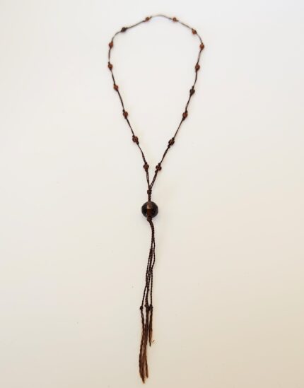 Brown beaded necklace with tassels.