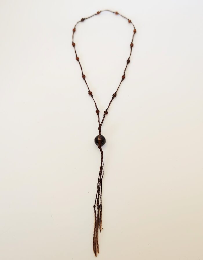 Brown beaded necklace with tassels.