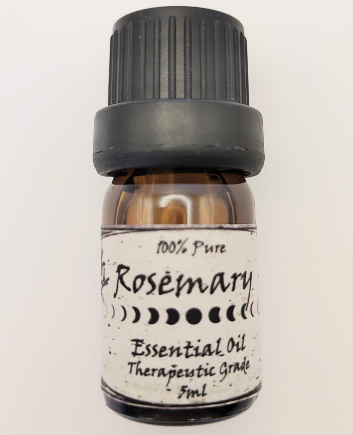 Rosemary essential oil in glass bottle.