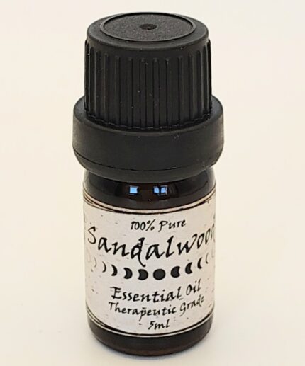 Sandalwood essential oil in a small bottle.