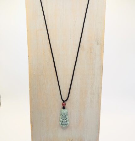 Jade Buddha pendant on black cord necklace.