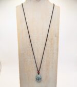 Jade Buddha pendant on black cord necklace.