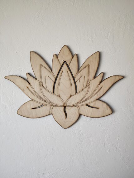 Wooden cutout of a lotus flower.