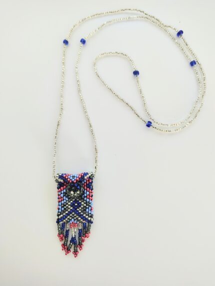 Beaded necklace with blue and red pendant.