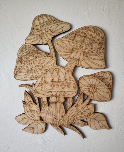 Wooden carved mushrooms with leaves.