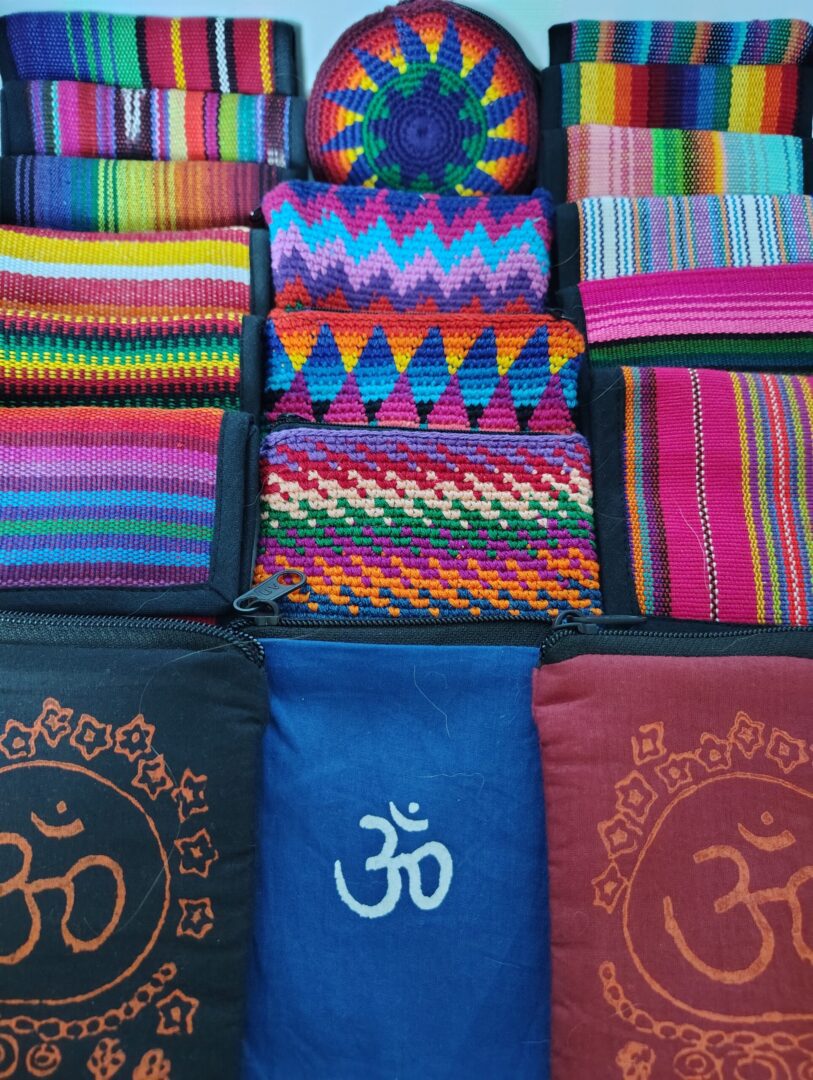 Colorful zippered pouches with Om symbol.