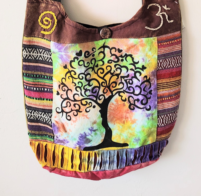 Colorful patchwork bag with tree of life design.