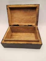 Open wooden box with black trim.