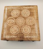 Wooden box with seven chakra symbols.