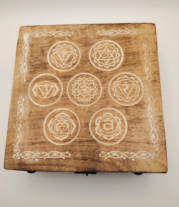 Wooden box with seven chakra symbols.