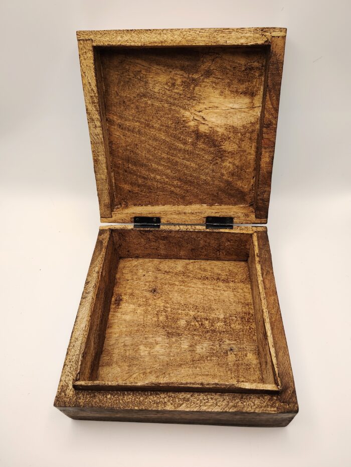 Open wooden box with hinged lid.