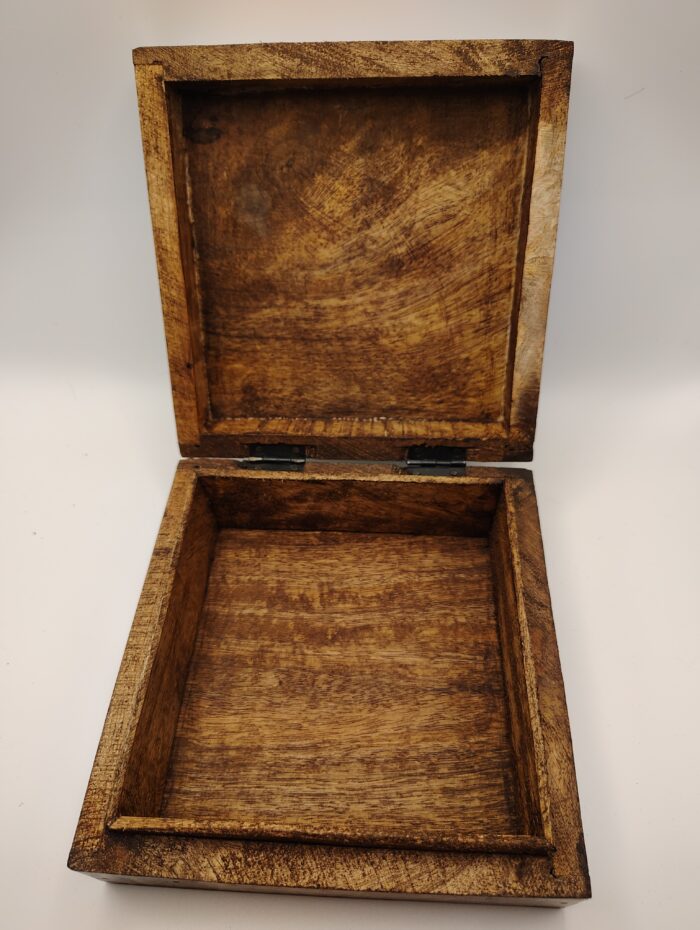 Wooden box open with hinges visible.